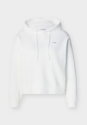 Λευκό φούτερ με κουκούλα και μακριά μανίκια, εμπρός τσέπη τύπου καγκουρό, κορδόνια και μικρό κεντητό λογότυπο κροκόδειλου της Lacoste στο στήθος.