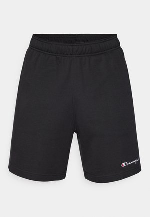 Pantalones cortos deportivos negros de tela suave. Cuentan con una cinturilla elástica y un pequeño logo blanco en la parte inferior derecha. Diseño sencillo.