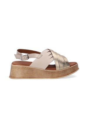 Beige leather sandal with metallic gold accents, open toe, and adjustable ankle strap. Features a wedge wooden sole with a textured finish.