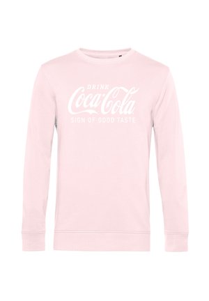 Jasnoróżowy sweatshirt z długim rękawem z białym napisem "Drink Coca-Cola Sign of Good Taste" wyśrodkowanym z przodu.