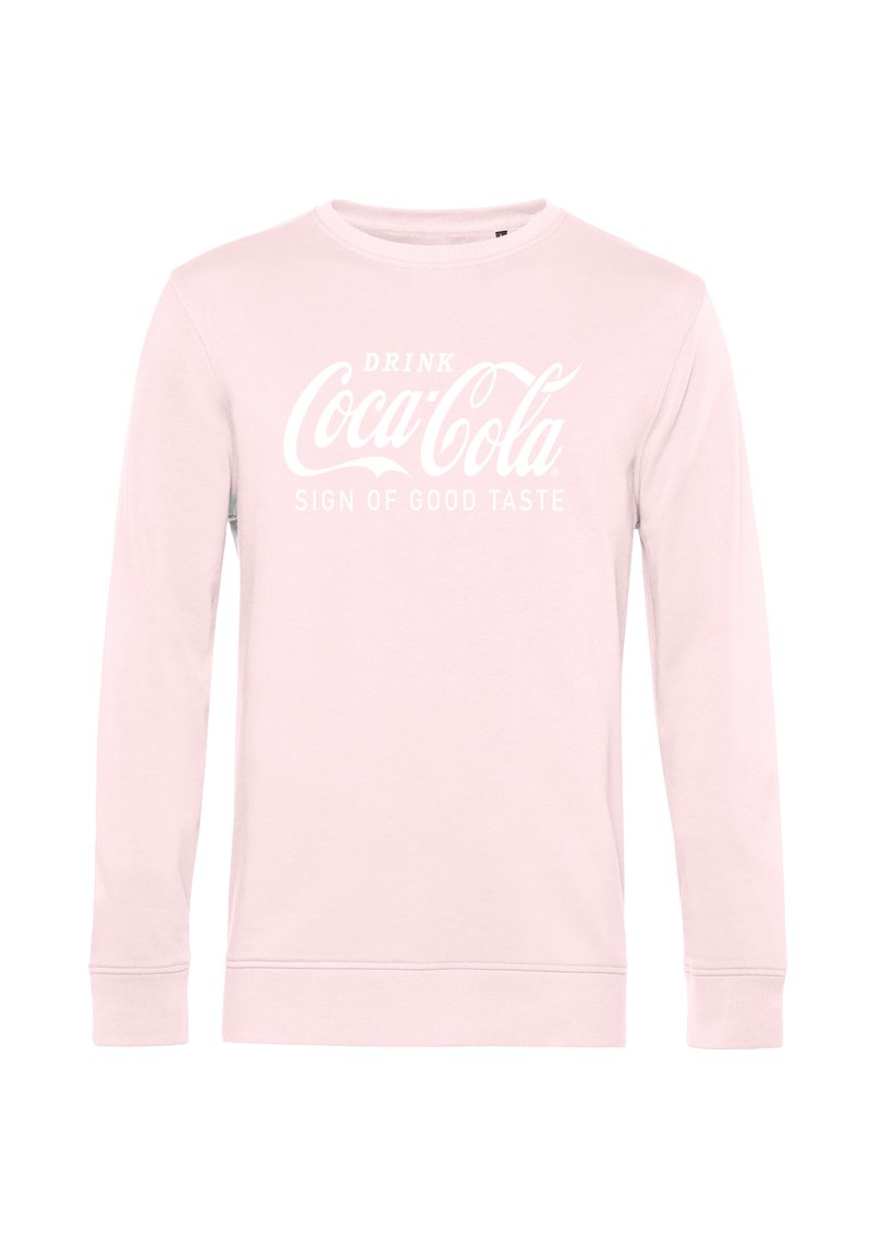 Světle růžová mikina s dlouhými rukávy a bílým textem "Pij Coca-Colu, znamení dobrého vkusu" umístěným ve středu přední části.