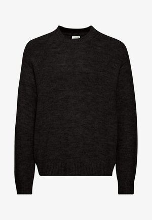 Must mustar ja ümmarguse kaelusega, pika varrukaga ja pehme tekstuuriga. Omab lihtsat kujundust ilma mustrite või kaunistusteta.