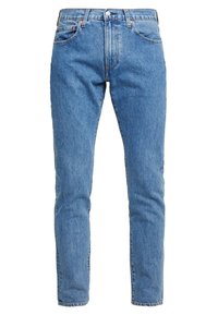 Blå denimjeans med smal passform, med knäppning fram, bälteshällor och framfickor. Tyget har en ljus tvätt och lätt blekning.