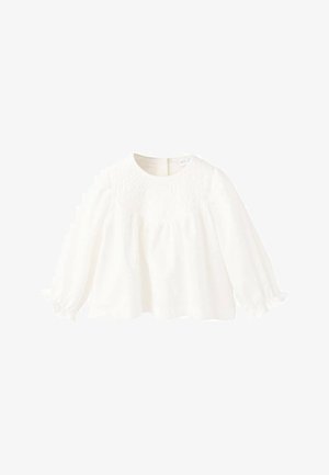 White long-sleeve blouse with a round neckline, featuring smocking detail on the bodice and gathered sleeves ending with elastic cuffs.