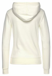 Kapuzensweatshirt in hellem Creme, aus weichem Stoff gefertigt. Es verfügt über eine klassische Kapuze, lange Ärmel und eine taillierte Passform mit gerippten Bündchen und Saum.