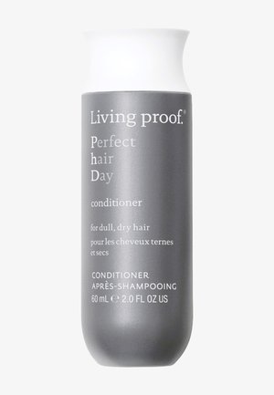 Bottiglia di balsamo Living Proof Perfect Hair Day per capelli opachi e secchi, 60 ml, grigia con tappo bianco e testo bianco.