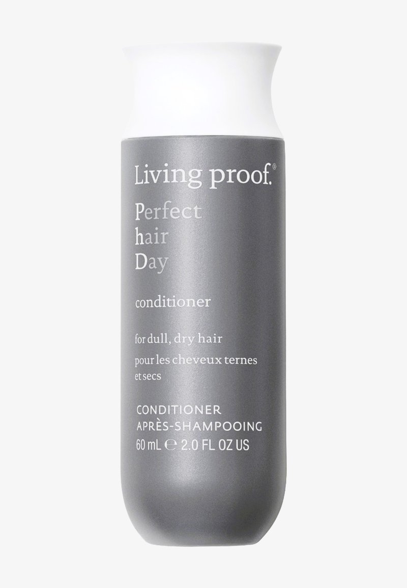 Flacon de soin Living Proof Perfect Hair Day pour cheveux ternes et secs, 60 ml, gris avec bouchon blanc et texte blanc.