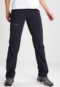 Černé odnímatelné outdoorové kalhoty s lehkou strukturovanou tkaninou. Obsahují několik kapsiček na zip a logo detail na stehně.