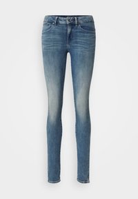 Slim jeans i medelblå denim med en lätt blekning, klassisk femfickdesign, bältesöglor och knappstängning.