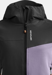 Black and purple softshell jacket with hood, full-length zipper, and textured material. Features logo and brown accent near zipper.