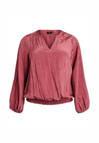 Ružičasta bluzica dugih rukava s V-izrezom, elastičnim porubom i blago teksturiranom tkaninom.