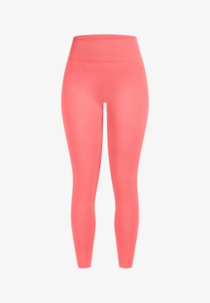 Korallenfarbene Leggings mit hohem, geripptem Bund. Hergestellt aus glattem, dehnbarem Material. Eng anliegendes Design, das bis zu den Knöcheln reicht.