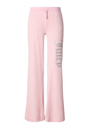 Rozā sporta bikses no mīksta materiāla ar platiem kāju galiem, divām priekšējām kabatām un sudraboti mirdzošu tekstu pa kreisi, kur rakstīts “Juicy”.