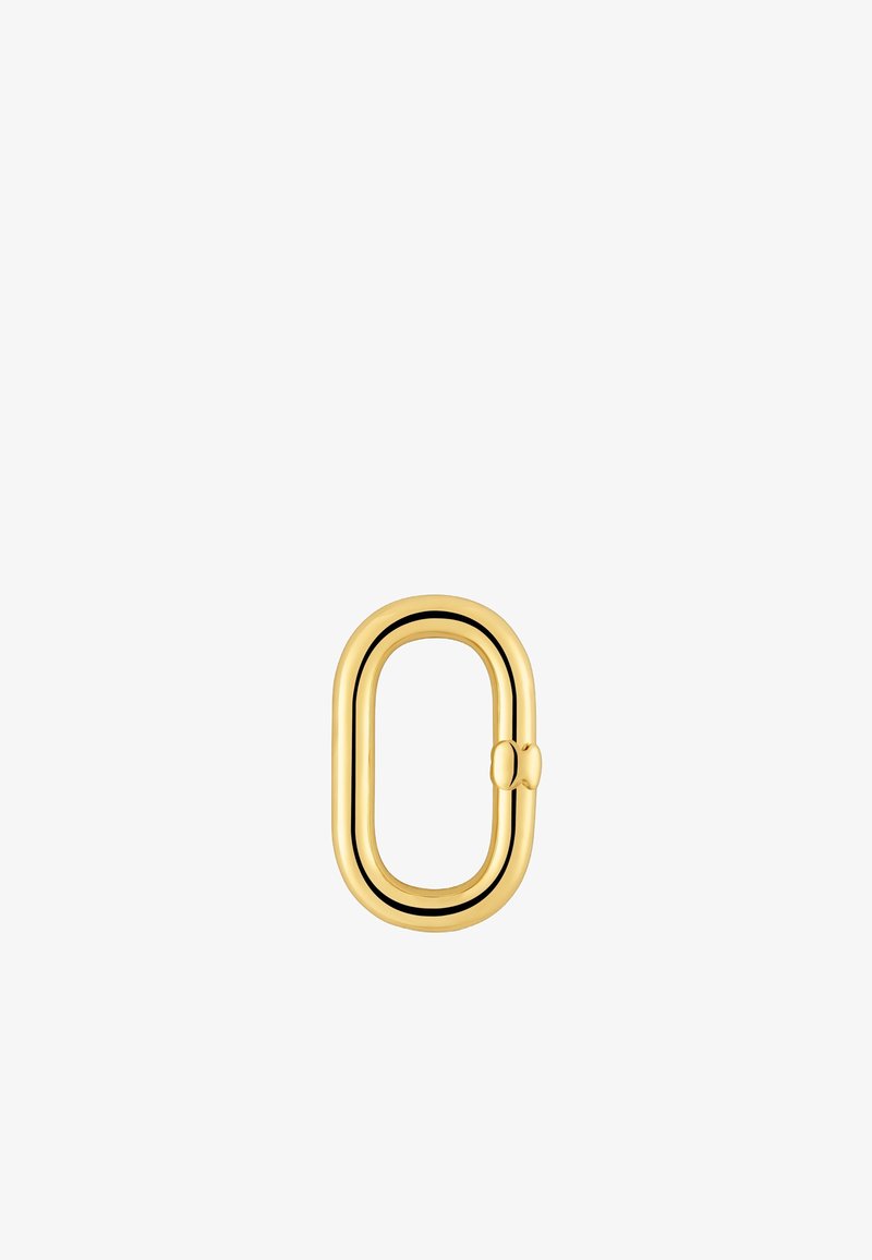 Accessoire en métal doré présentant une forme ovale allongée avec une finition lisse et un petit détail de fermoir sur un côté.