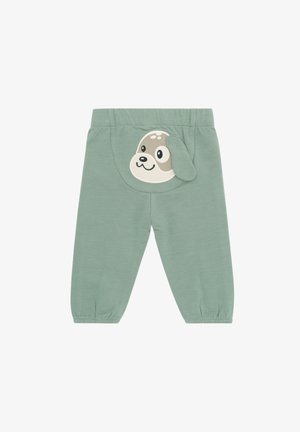 Zielone bawełniane spodnie z tylną aplikacją w kształcie twarzy psa z uszami. Miękka tkanina, elastyczny pas i zwężane mankiety.