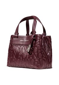 Sac à main en cuir bordeaux avec logo 'Armani Exchange' en relief, finition texturée, deux poignées solides et détail en finition métallique.