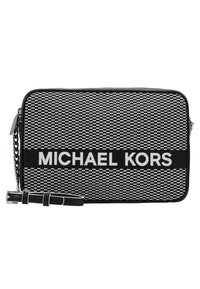Black and white woven fabric crossbody bag with a rectangular shape, featuring a prominent "MICHAEL KORS" logo and silver chain strap.