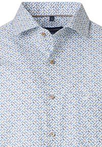Button-up shirt in light blue with a geometric pattern in dark blue, green, and gray. Features a spread collar and patch pocket.