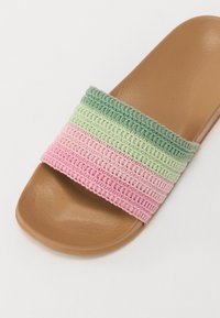 Lightweight slip-on sandal with a brown plastic sole and a multicolored woven strap featuring pink, green, and light green horizontal stripes.