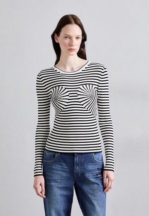 Black and white striped long-sleeve top with a fitted design and textured fabric, featuring a minimalistic pattern across the chest.