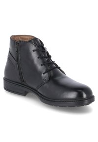 Bota de tobillo de cuero negro con cordones en la parte frontal, cremallera lateral, costuras en contraste y un acabado pulido y elegante. Suela plana y punta redondeada.