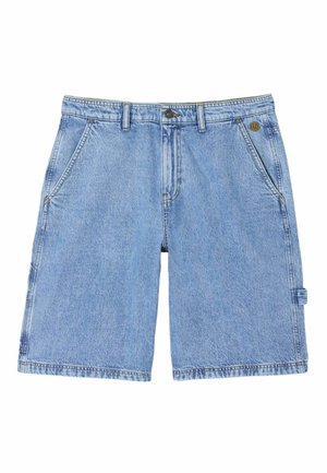 Helesinised teksapüksid, millel on ees taskud, vööaasad, nööbi- ja tõmblukukinnitus ning väike aas paremal küljel.