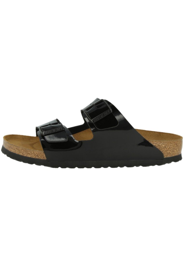 Svart lackad slidesandal med två justerbara remmar, korkfotbädd, texturerad sula och slät yta. Ergonomisk design för komfort.