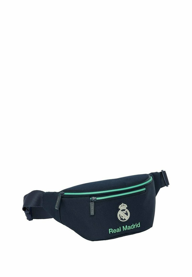 Marsupio navy realizzato in tessuto resistente, con dettagli in verde sulla cerniera, logo e tracolla regolabile per una vestibilità sicura. Design compatto con due tasche.