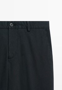 Black cotton pants featuring a flat front, button closure, and side pockets, with a smooth texture and tailored design.
