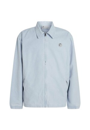 Light blue zip-up jacket in a soft, smooth fabric with a collared neckline, elastic cuffs, and side pockets. Features a small logo on the chest.