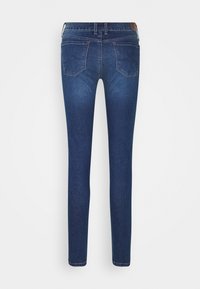 Smal passform mörkblå denimjeans med en mjuk yta. Har en medelhög midja, fem fickor och diskret söm på bakfickorna.