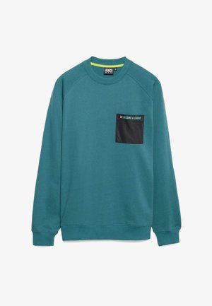 Sudadera de color azul verdoso con escote redondo, mangas raglán y un bolsillo negro que lleva el texto "CONVIÉRTETE EN UNA LEYENDA." Tejido suave con una textura lisa.