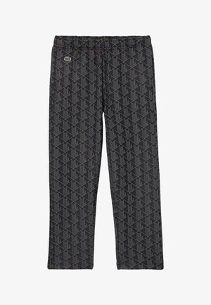 Pantalons en polaire noire avec un motif géométrique gris, une taille élastique et un petit logo sur le devant gauche.