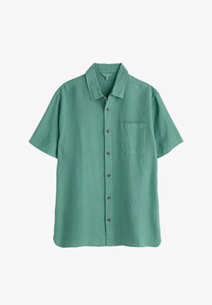 Kratka majica s kratkimi rokavi v svetlo zeleni tkanini. Ima ovratnik, žep na prsih in rjave gumbe spredaj. Material je rahlo strukturiran.