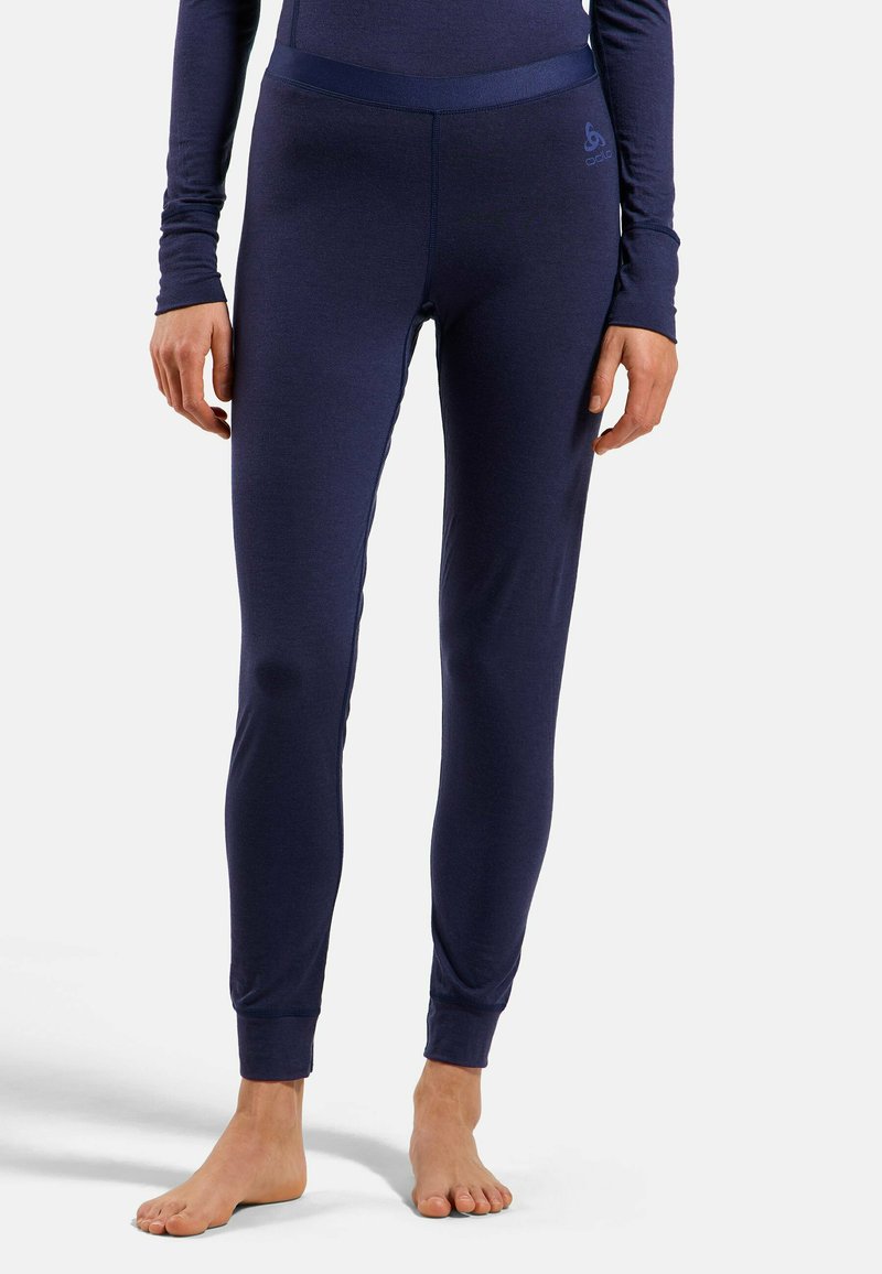 Navy athletic leggings with a fitted design, soft fabric, and elastic waistband. Cuffs at the ankles provide structured fit.