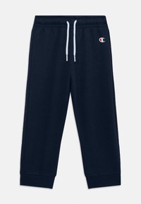 Námořnické tepláky vyrobené z měkkého materiálu. Mají stahovací pás a elastické manžety. Malé logo na horní části nohavice.
