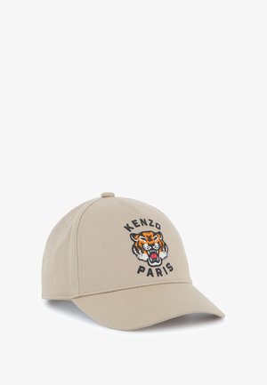 Casquette de baseball beige en coton, ornée d'un motif de tigre brodé et du texte "KENZO PARIS" en noir et orange. Visière incurvée.