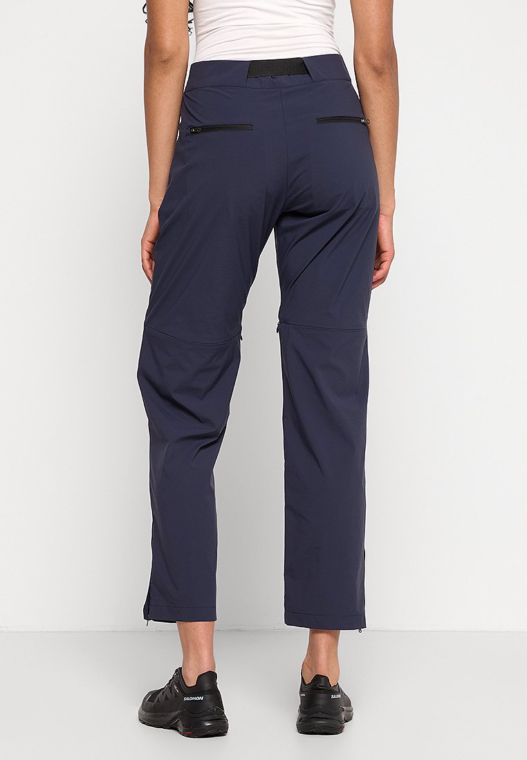 Navyfarbene Hosen mit einer taillierten Form, aus leichtem Material gefertigt, mit Reißverschlusstaschen und einem flexiblen Bund für mehr Komfort.