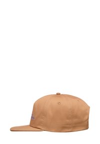 Tan baseball cap with a flat brim, cotton material, stitched eyelets, and a purple embroidered logo on the front.