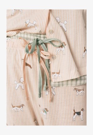 Set di pigiama leggero con righe pesca e bianche, caratterizzato da vivaci motivi di cani. Laccetti in colori contrastanti verde e pesca.