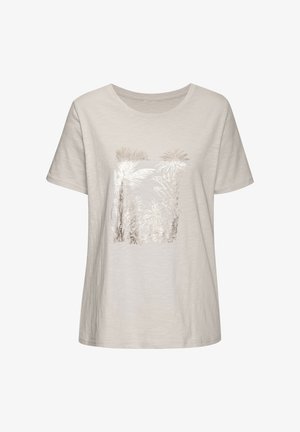 Svetlo bež bombažna majica s kratkimi rokavi, ki na sprednji strani prikazuje kovinski grafični motiv palme v središču. Mehka tekstura, sproščen kroj.