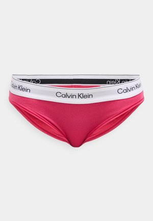 Vaaleanpunaiset puuvillaiset bikinimalliset alusvaatteet, joissa on valkoinen ja musta elastinen vyötärönauha, jossa on "Calvin Klein" -logo. Sileä pinta ja istuva muoto.