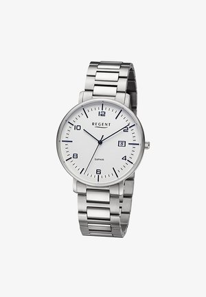 Montre-bracelet en métal argenté avec cadran rond blanc, index horaires noirs, affichage de la date à 3 heures et trois aiguilles indiquant 10:10:37.