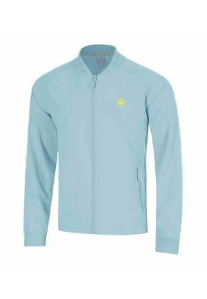 Hellblaue Jacke mit Reißverschluss, langen Ärmeln, gerippten Bündchen und kleinem rundem gelben Logo auf der linken Brust.