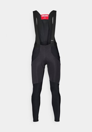 Calças de ciclismo pretas com alças ajustáveis, painéis em malha e assento almofadado; combina diferentes texturas de tecido para conforto e ajustamento.