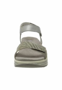 Open-toe sandal in light gray with a textured strap. Features an adjustable ankle strap and a cushioned insole on a flexible sole.