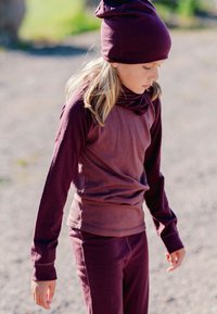 Maroon long-sleeve top and pants set, made of soft fabric with a smooth texture. Top features a high collar, and the hat has a pointed tip.