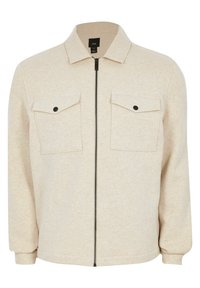 Giacca beige con zip realizzata in morbido tessuto, dotata di colletto a punta, due tasche sul petto con acqua e polsini aderenti.