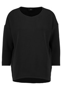 Felpa nera oversize con scollo rotondo, maniche a tre quarti e tessuto testurizzato. Presenta un orlo dritto e dettagli di cucitura minimi.