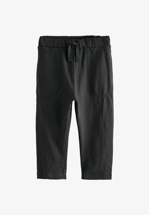 Leggings neri realizzati in materiale morbido, dotati di una vita elasticizzata con coulisse, due tasche frontali e dettagli di cucitura precisi.